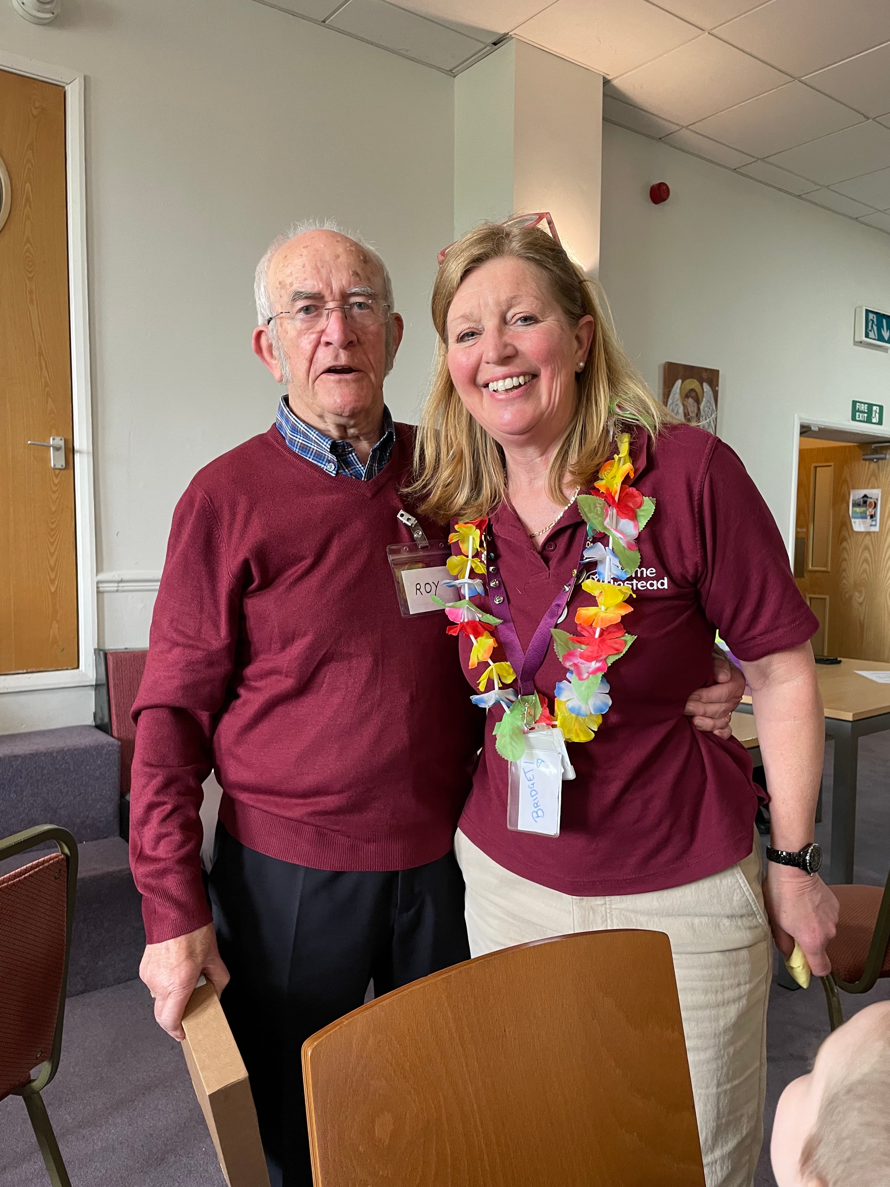 Bridget and volunteer smiling at the Memory café - Home Instead