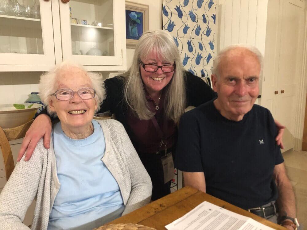 Care assistant Tina supports an older couple to remain independent at home