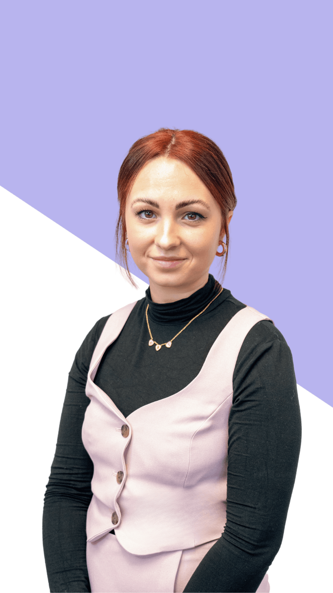 Woman with red hair in a pink vest and black top, sitting against a purple and white background. - Home Instead