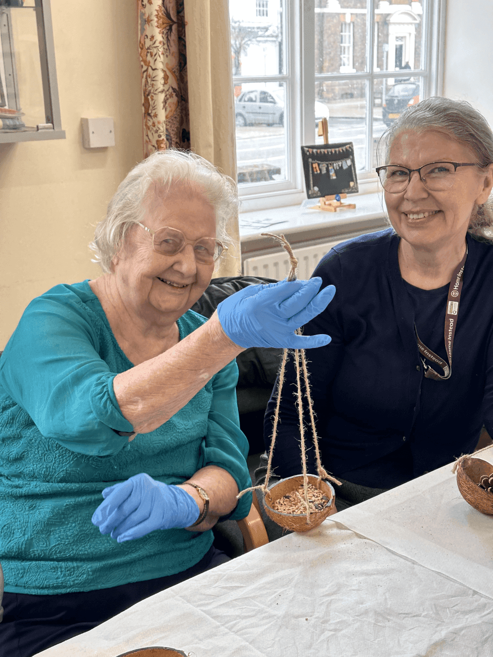 Dementia friendly activities for Seniors, crafting fun make these rustic birdfeeders with coconut shells or pinecones.