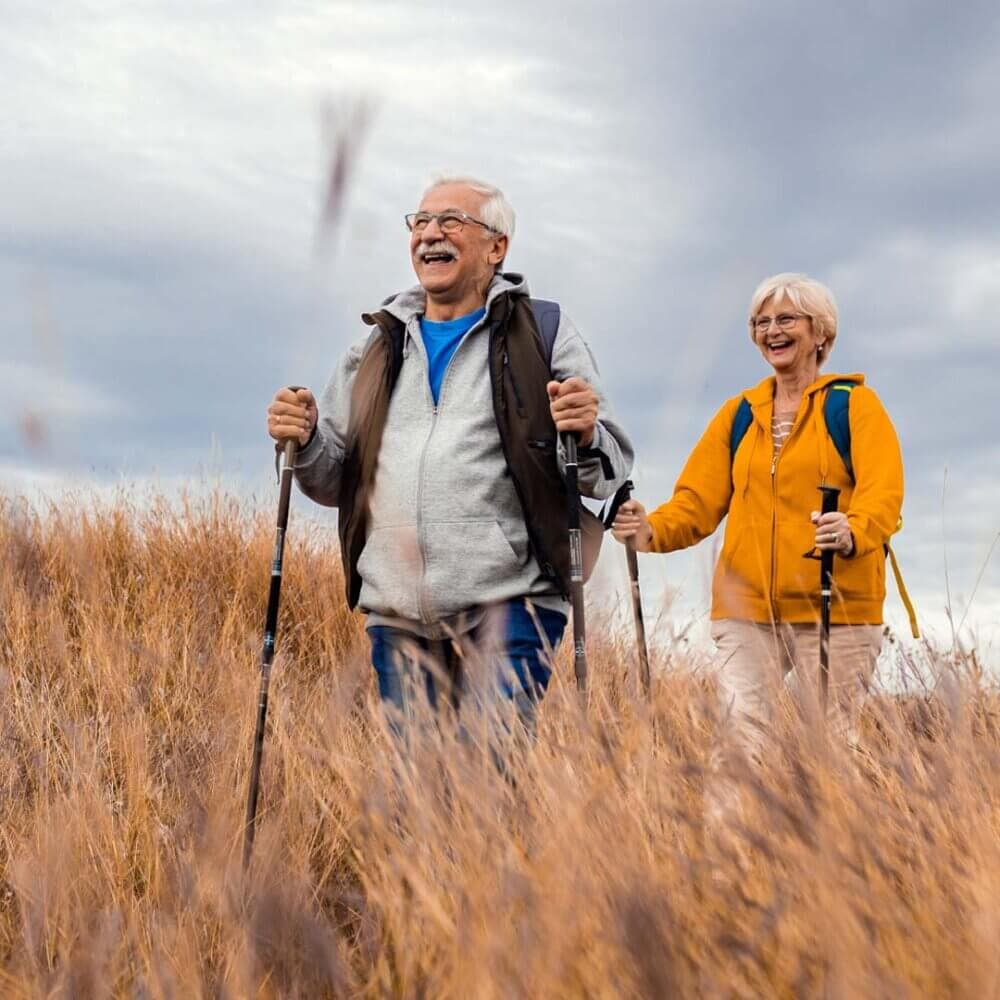 senior couple outdoors hill walking