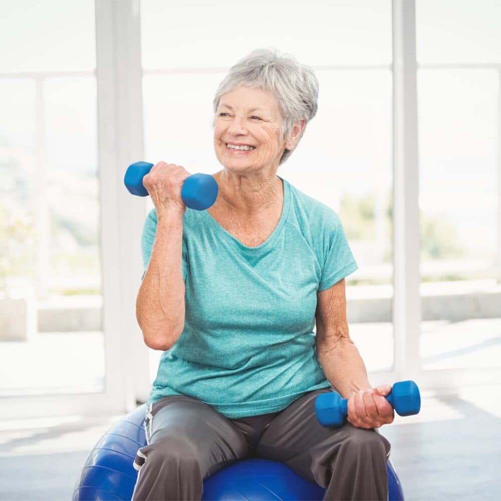 elderly senior lifting small weights exercising