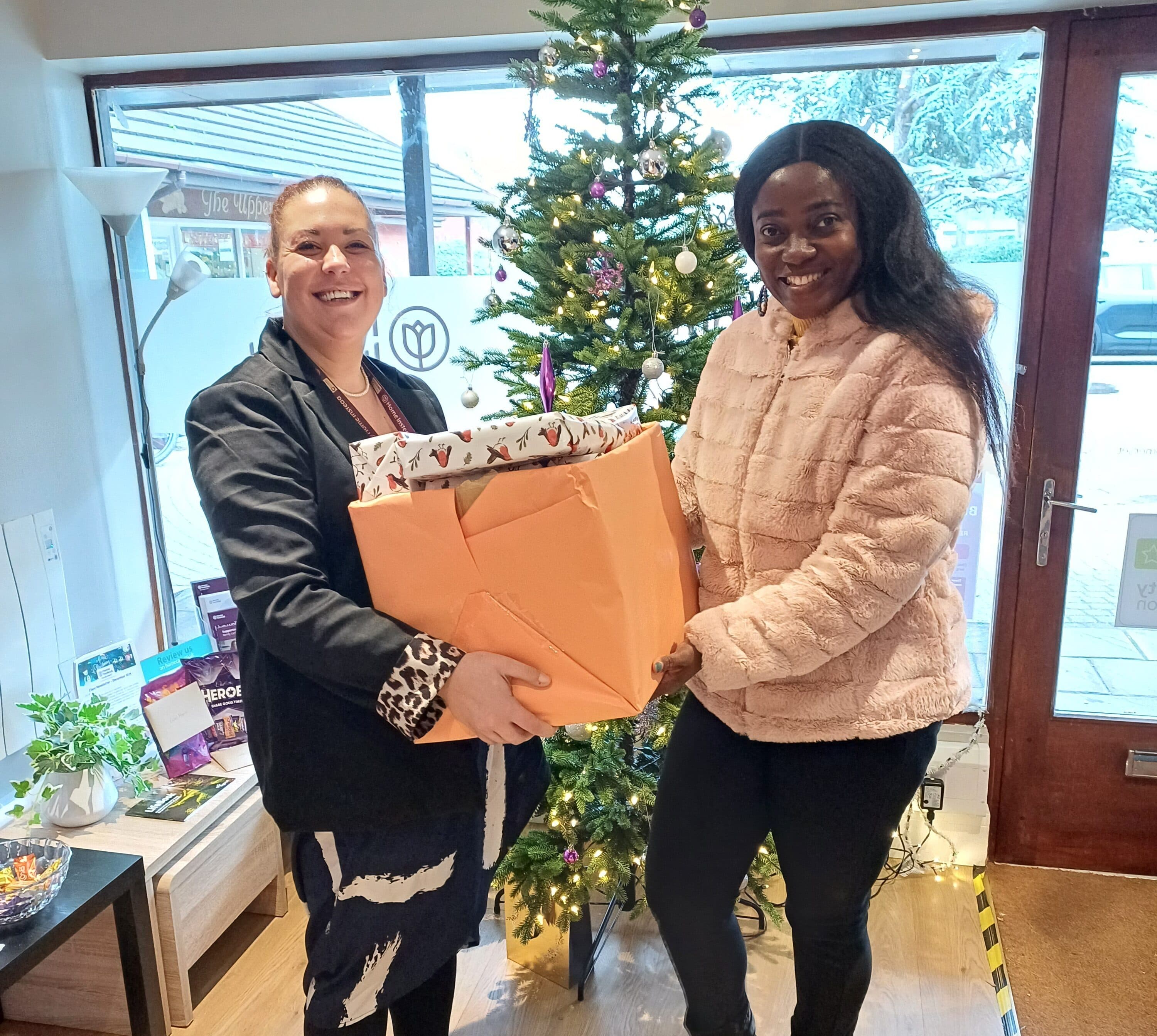 Diversity Voice team receiving the gifts from Louisa our recruitment coordinator