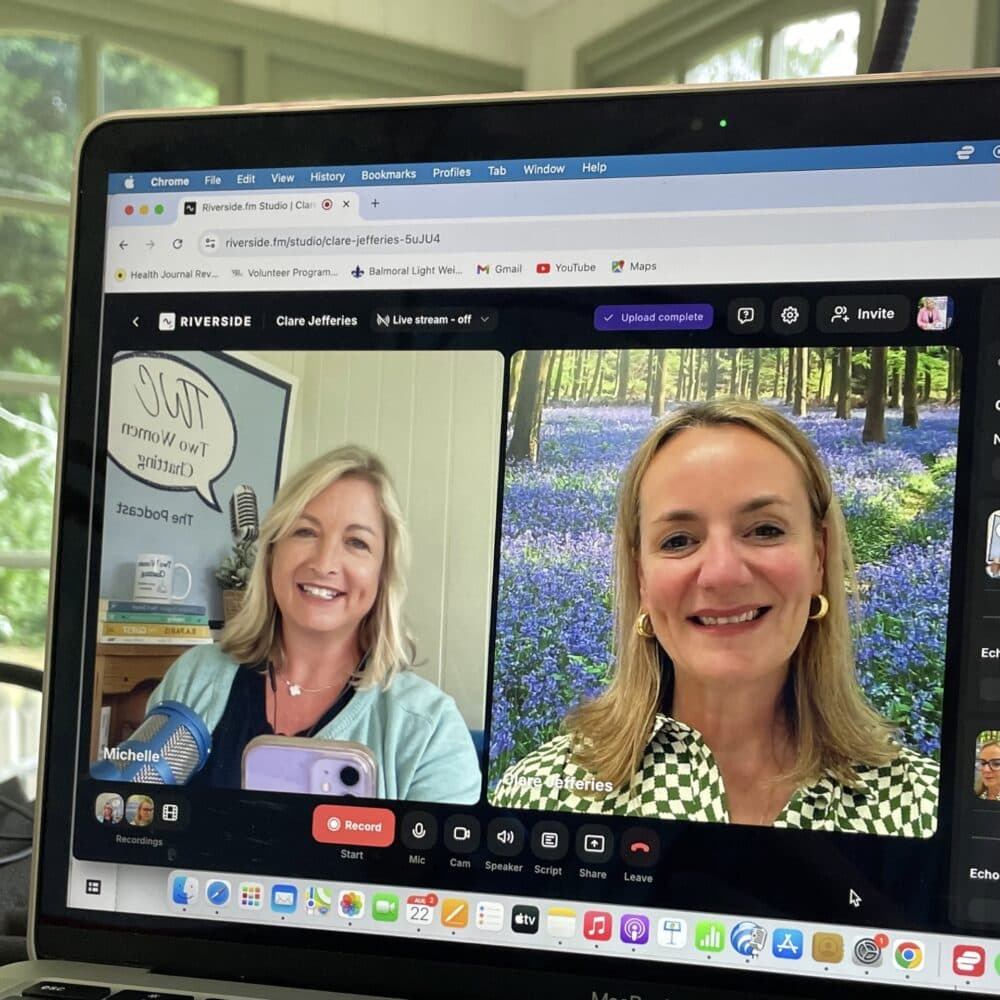 A laptop screen shows two women smiling on a video call, each in different bright indoor settings. - Home Instead