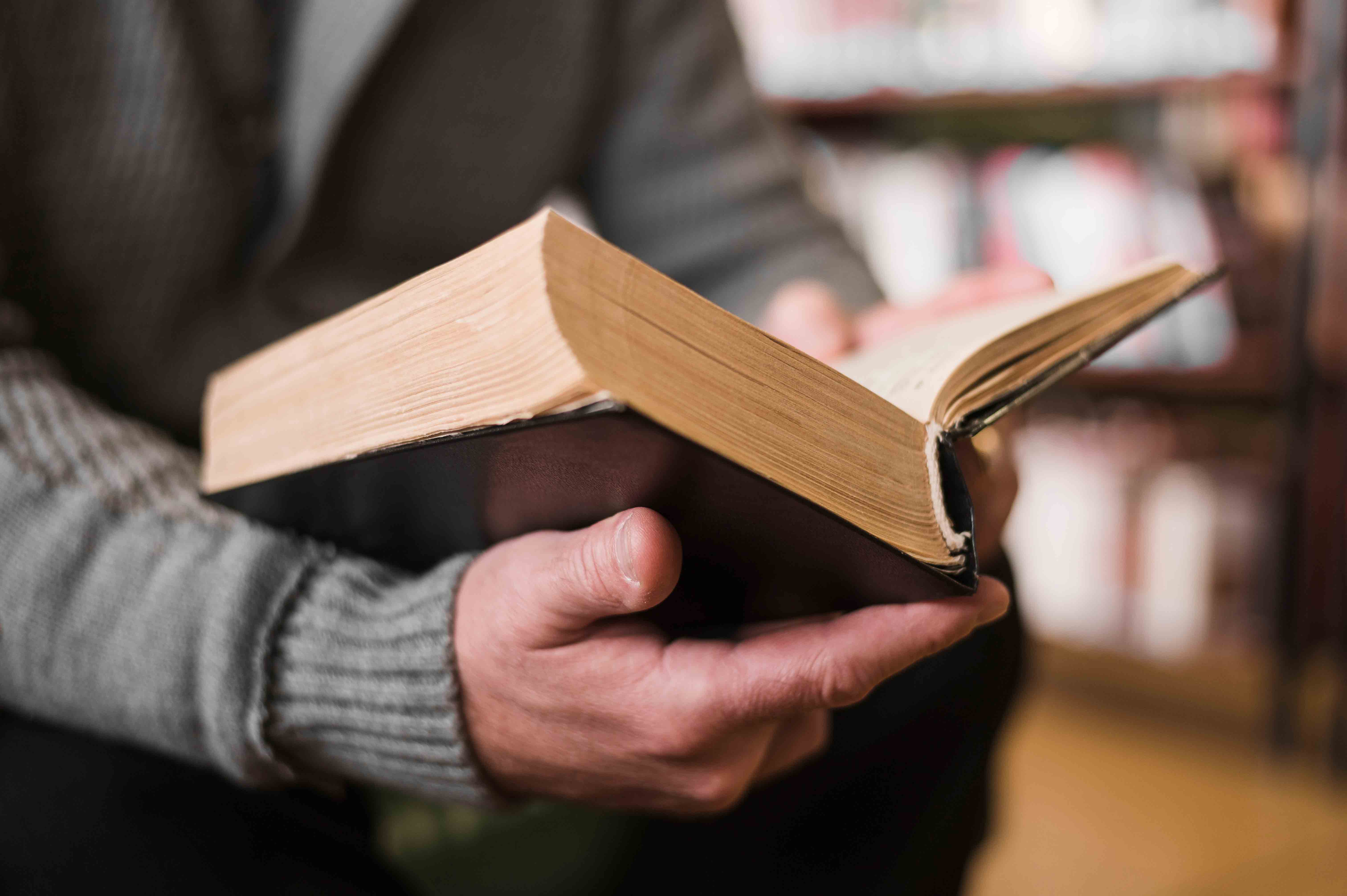 Older adult reading a book.