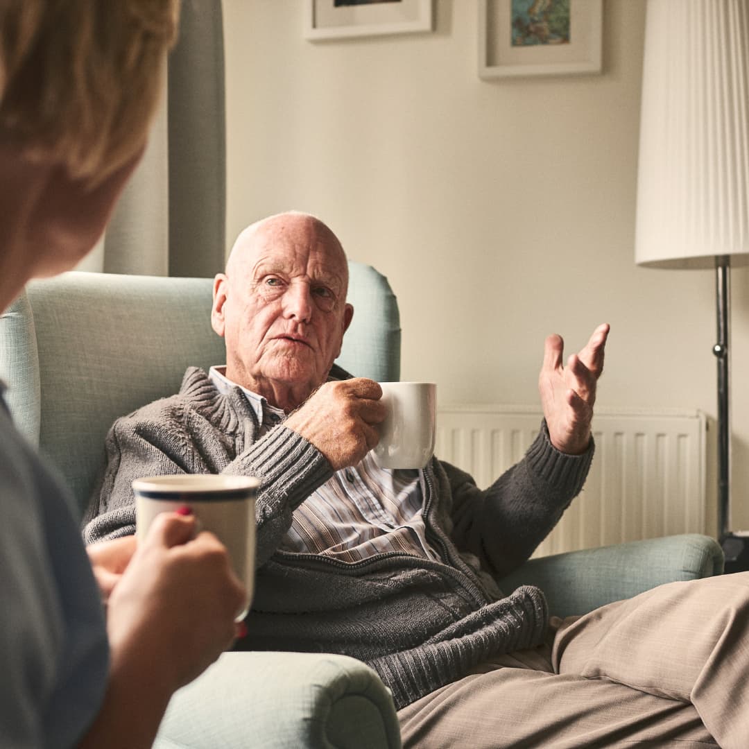 Home Care Visit with cup of tea