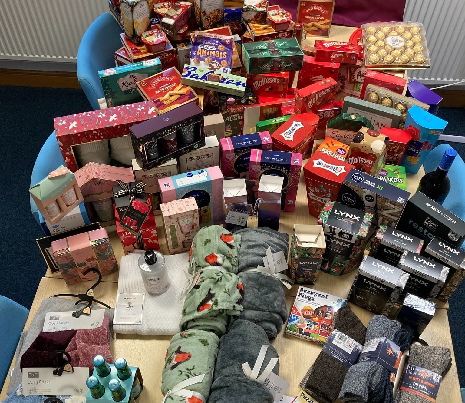 Gifts on a table, wrapped and unwrapped