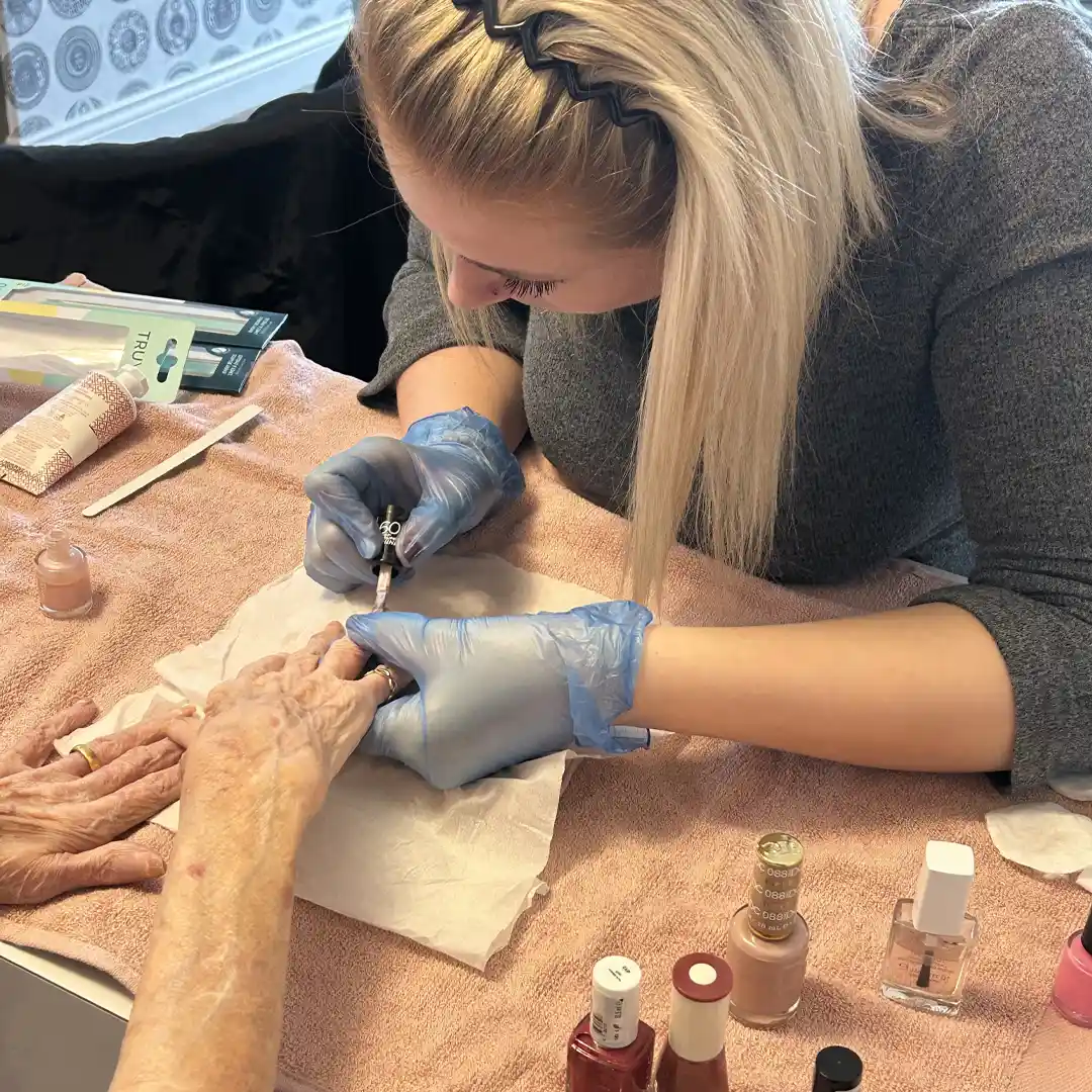 Home Instead Watfords' Grace doing a nail care pamper session at Carpenders Park Care Home