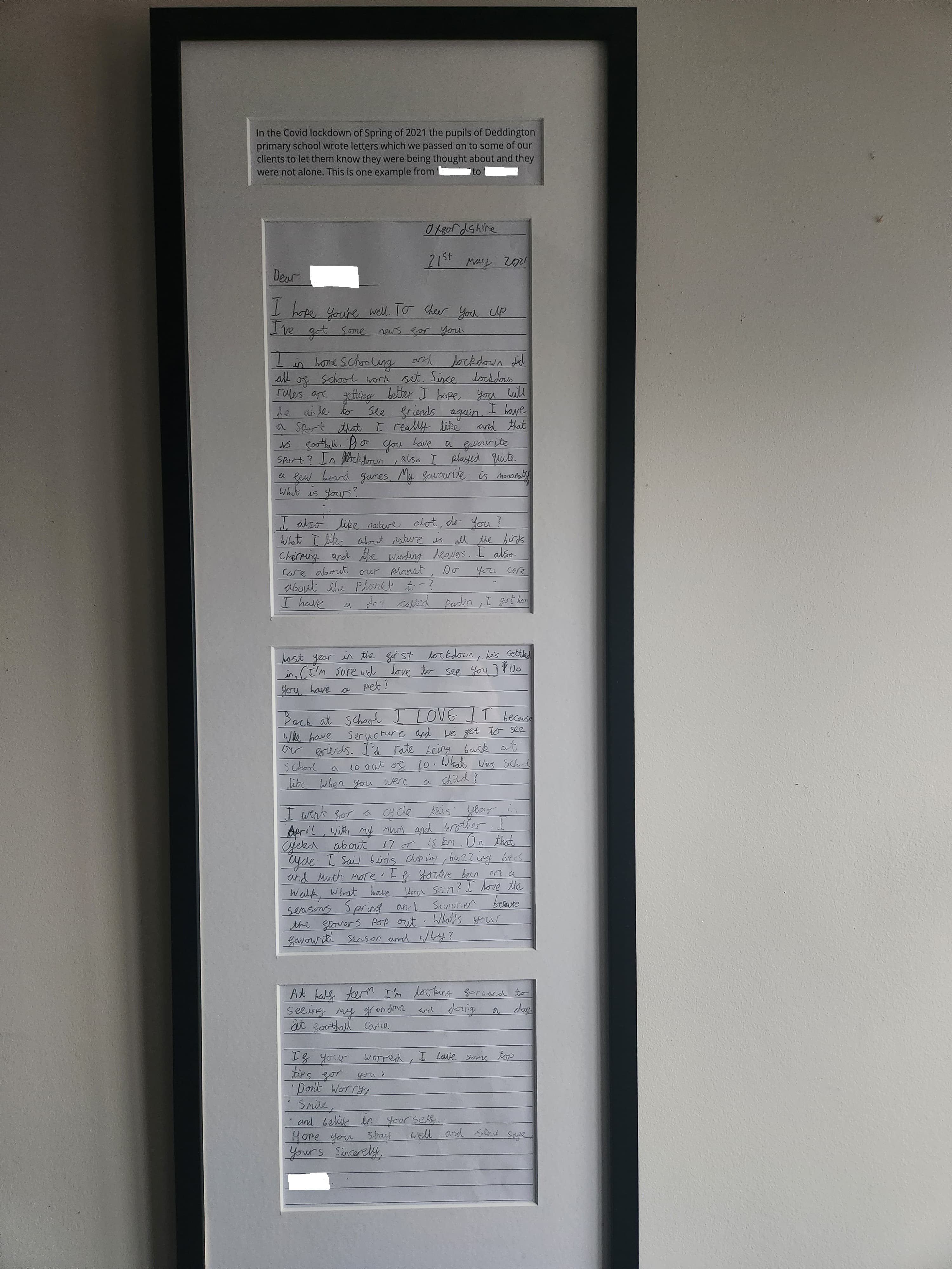 A framed display of three handwritten letters, each on lined paper, mounted vertically on a white background. - Home Instead
