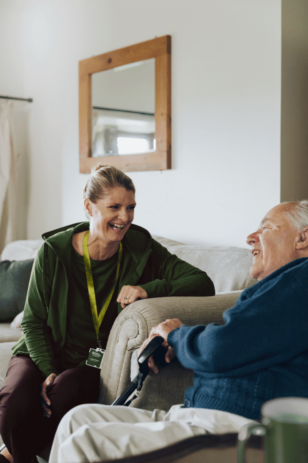 Client and Care Professional laughing - Home Instead