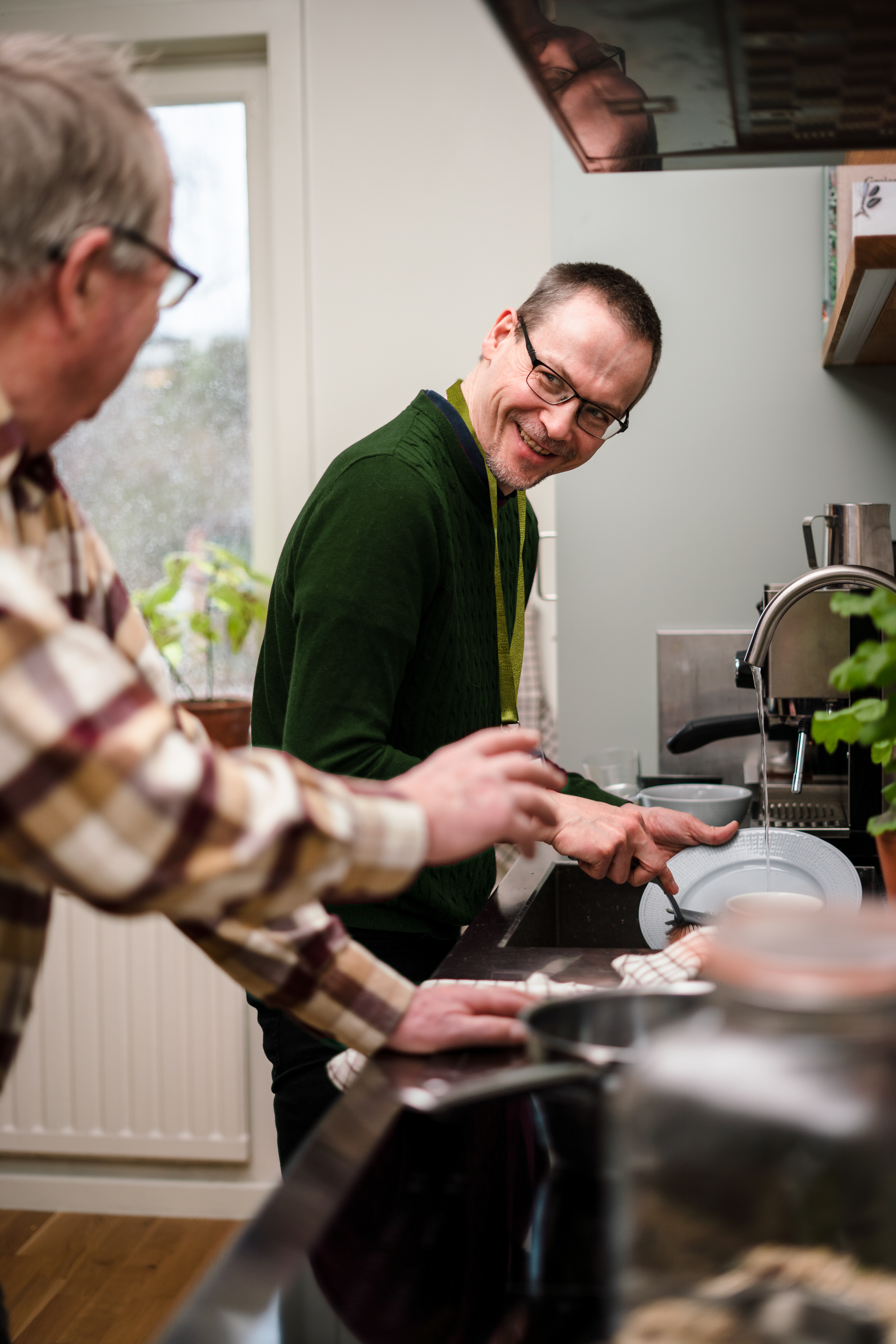 Client & Care Professional washing up - Home Instead